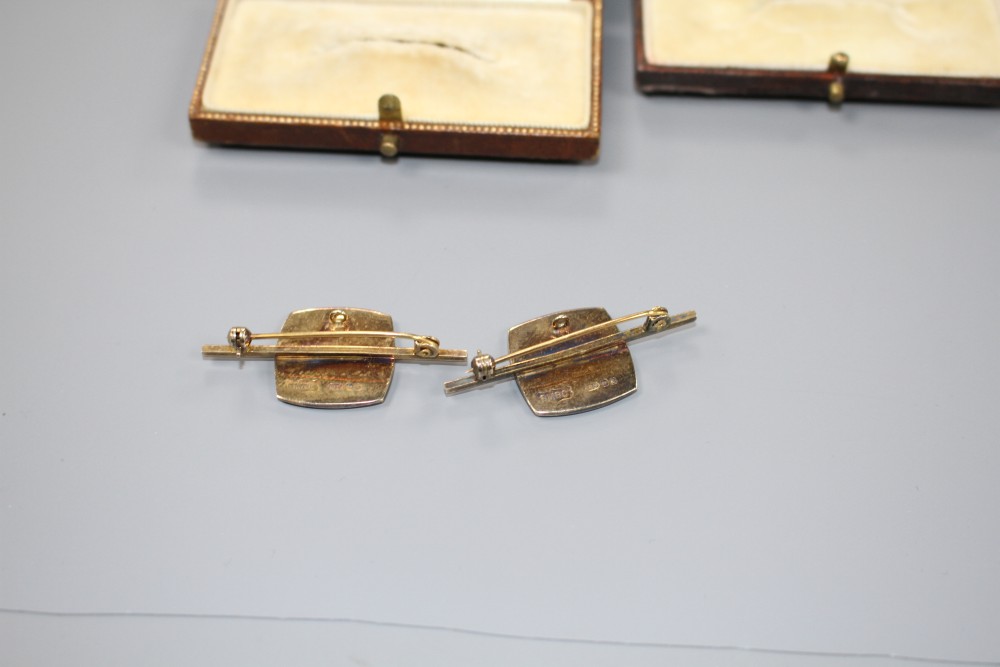 A modern pair of silver gilt and enamel brooches, decorated with ornate crest, 42mm, gross weight 14.6 grams.
